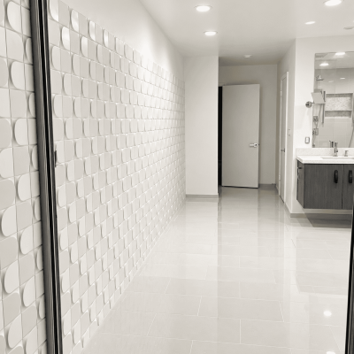 Contemporary white tile wall in a modern bathroom.